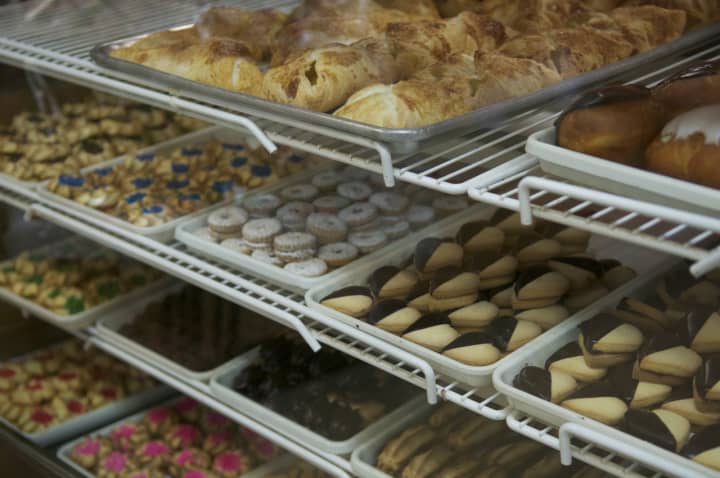 The shelves are stocked with freshly baked cookies and pastries.
