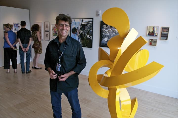 David Boyajian with his sculpture, &#x27;Dancing Sunflower II.&#x27;