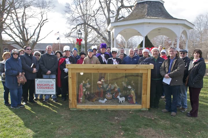 A group gathers at the Monroe Town Green on Saturday for a Blessing of the Creche.