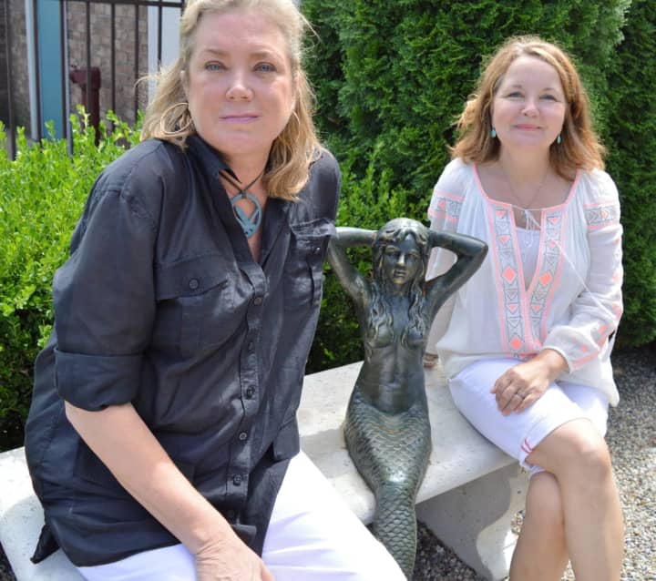 Ivy Becker, left, and Pam Greenberg in the garden at OLIVE 54.
