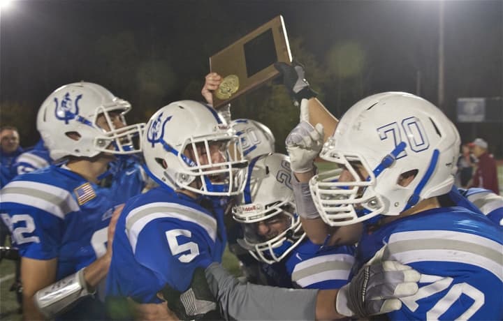 Haldane players hoist the Section 1 Class D championship plaque after beating Tuckahoe Friday at Mahopac.
