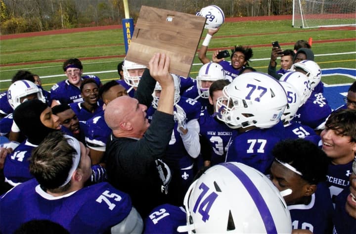 New Rochelle coach Lou DiRienzo with his players.