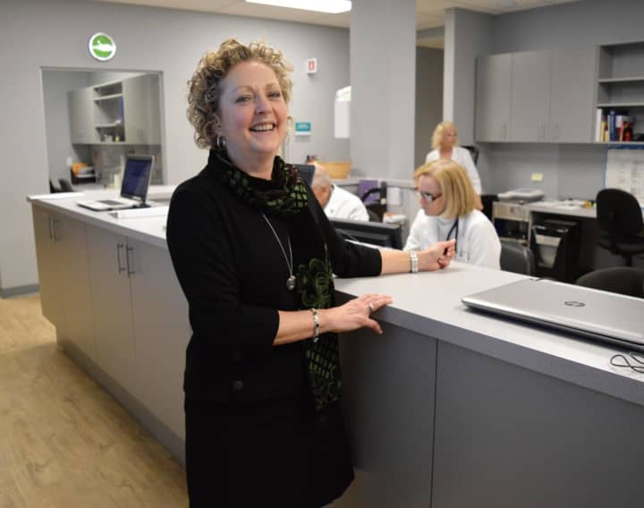 Amanda Missey, executive director of BVMI, at the nursing station in the new Lynn Diamond Healthcare Center, named for a donor.