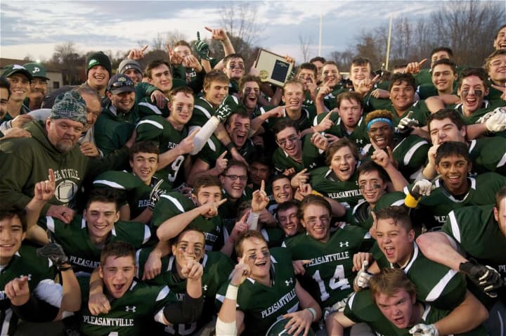 Pleasantville celebrates with the Section 1 championship trophy Saturday at Mahopac High School.