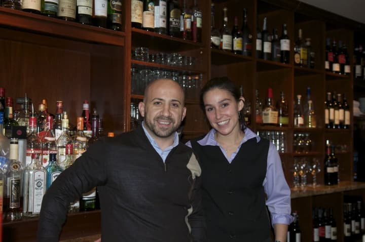 Aroma Osteria Owner Alex Kovacs with Catherine Lugones.