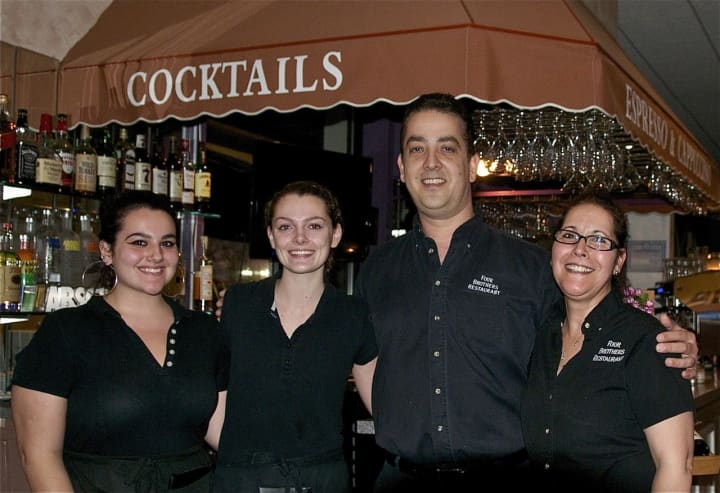 Manager John Velezis with Four Brothers staff members. Four Brothers Restaurant has been a family-focused Mahopac favorite since 1984.