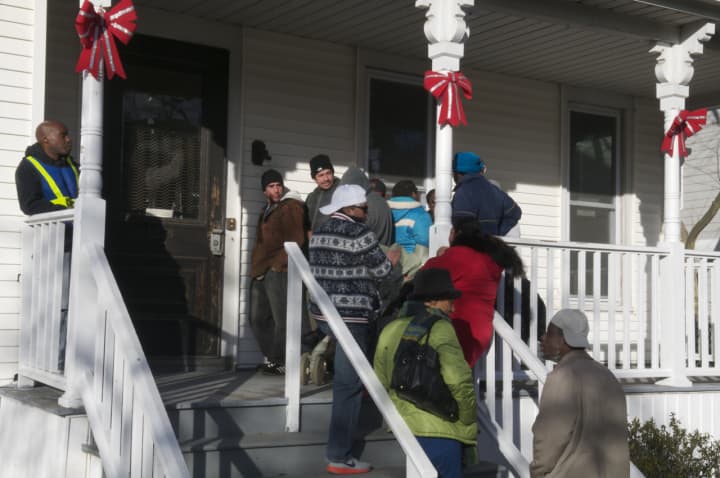 Men wait on line to get coats and clothing at the Bridgeport Rescue Mission. The shelter is expecting a full house as the temperatures continue to drop below freezing.