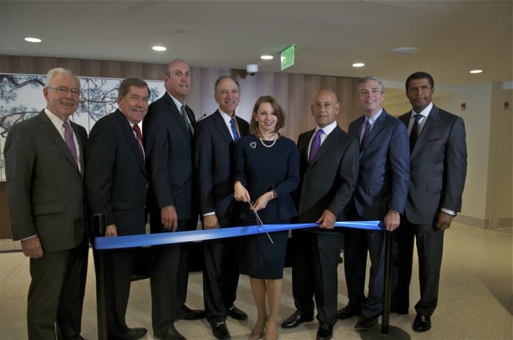 City officials and dignitaries including Mayor Tom Roach (2nd from R), Susan Fox (with scissors), Kevin Plunkett (3rd from L), Steven Safyer (3rd from R) and Larry Smith (4th from L) at Monday&#x27;s ribbon cutting ceremony at White Plains Hospital.