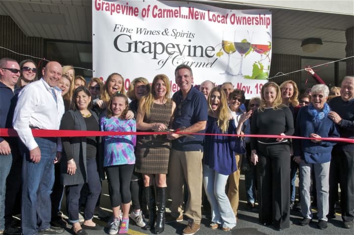 Community members, family, the Carmel-Mahopac Chamber of Commerce, and Putnam County Executive Mary Ellen Odell (fourth from R) all came out Saturday to show some love for Grapevine of Carmel Fine Wines and Spirits.