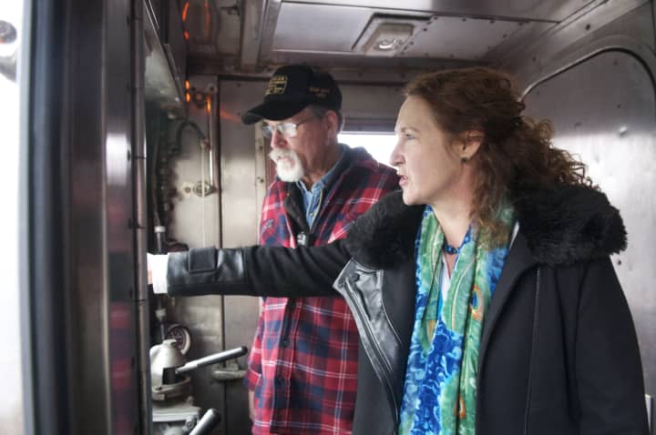 U.S. Rep. Elizabeth Esty tours the Danbury Railroad Museum Thursday, and drives one of the trains. Here, she gets a lesson from Conductor Jim Teer.