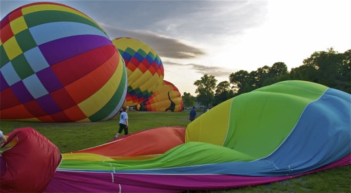 Balloons are inflated for a sunrise mass launch the 2013 HV Balloon Festival.