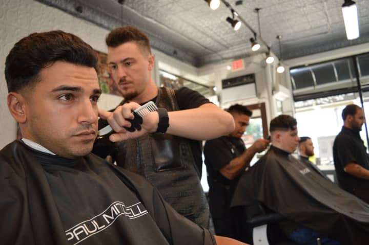 Michael Aspinwall of White Plains with a client at The Shave Bar and Barbershop in Hillsdale.
