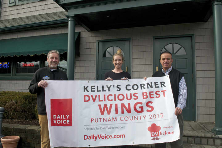 Kelly Quinn (L), Elle Quinn and Daily Voice Director of Media Initiatives/Managing Editor Joe Lombardi hold banner announcing Kelly&#x27;s Corner as &#x27;Best Wings in Putnam&#x27; winner.