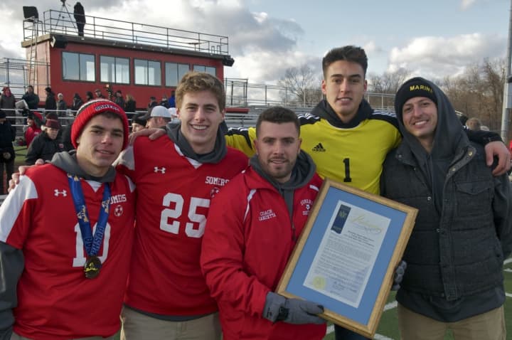 Coach Brian Lanzetta and captains from the 2016 Class A state championship boys soccer team at Saturday&#x27;s state championship celebration.