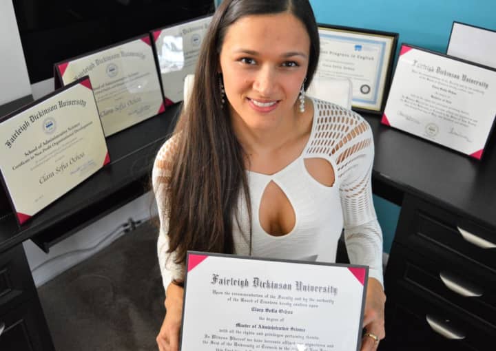 Clara Sofia Ochoa in her Hackensack apartment, surrounded by her academic degrees and certificates from Colombia and the U.S.