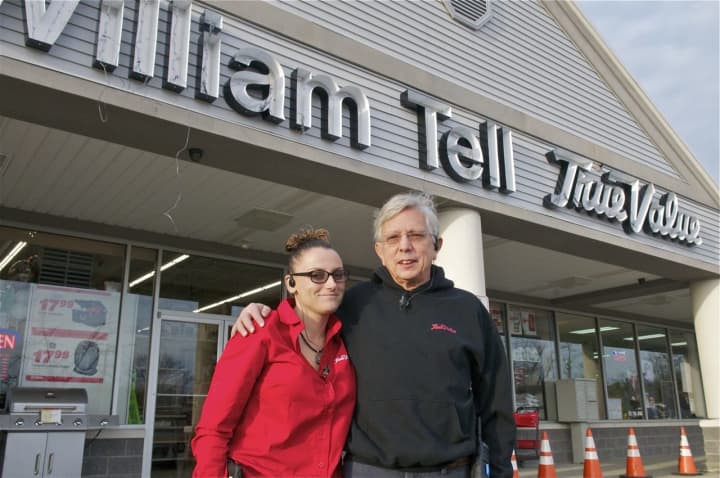 Carrie and David Tell in front of the new William Tell True Value Hardware store in Hopewell Junction.