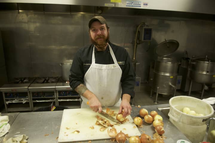 Owner Fred Bialek Jr. prepares soup in the kitchen at Liquid Lunch.