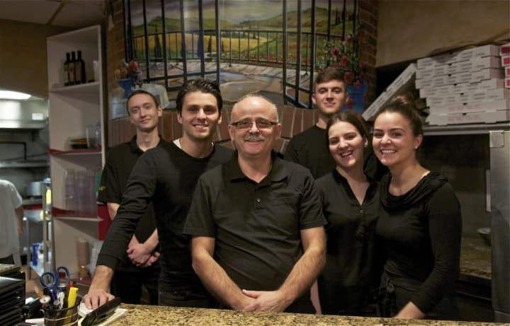 Luigi Rukaj (center) with family and staff from Luigi&#x27;s Italian Restaurant in Carmel.