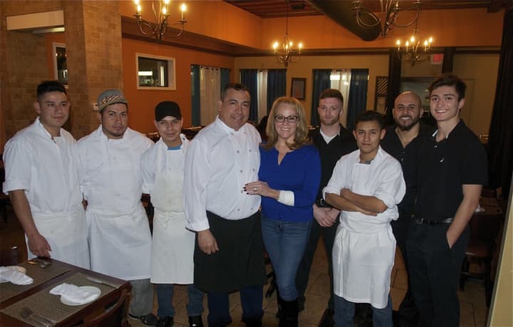 Owners Ramiro and Jan Jimenez (center) with some of the staff at Ramiro&#x27;s 954.