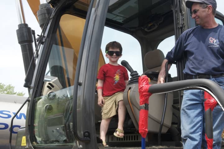 Kids check out emergency vehicles, motorcycles and the big rigs at Saturday&#x27;s Barnum Festival Touch-A-Truck event in Fairfield.
