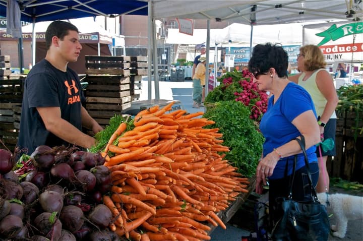 Local produce and lots of other goods brought nice crowds out to the Down To Earth Farmers Market in Ossining Saturday, despite temperatures in the mid-90s and high humidity.
