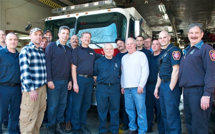 Poughkeepsie firefighter Mike Marinucci (center) got a warm sendoff from his fellow firemen Thursday in Poughkeepsie.