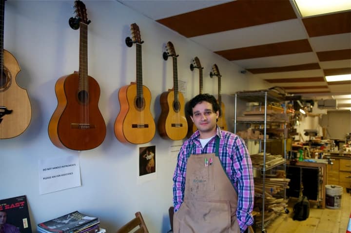 Beacon&#x27;s John Vergara in his Lord of the Strings guitar shop.