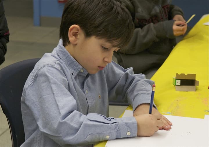 A child working on a craft project at the Brookfield Library. The Brookfield Library is hosting a &quot;Fun and Friends Hour&quot; for kids ages 6 months to 5 years old May 11.