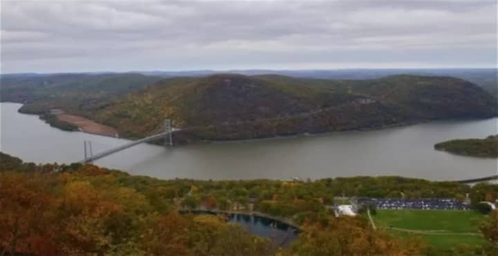 Three men were charged with climbing a tower at the Bear Mountain Bridge Monday.