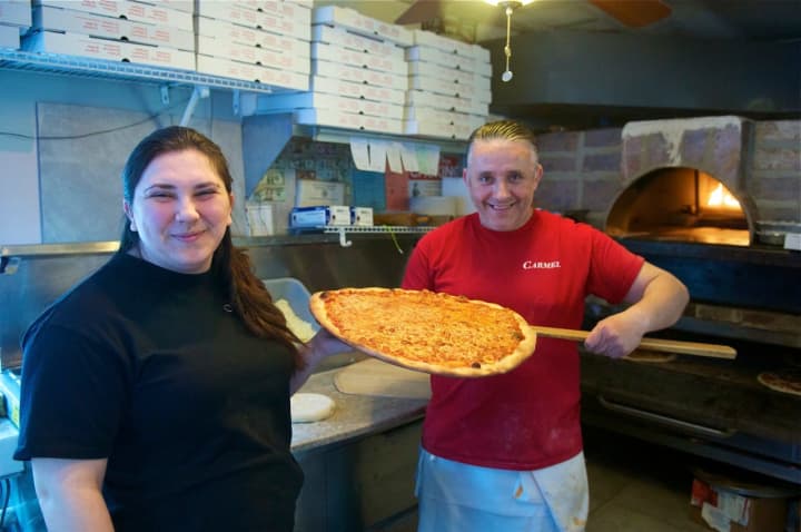 Thin crust, city-style pizza is the name of the game at Carmel Brick Oven Pizza &amp; Cafe in Lake Carmel. Owner Lindita Sutaj is on left.