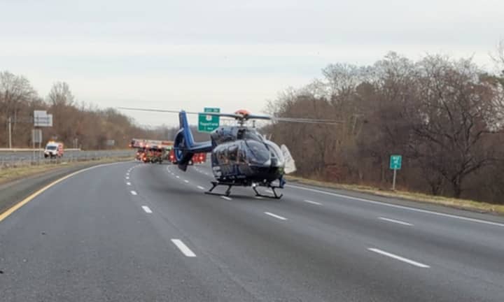 A medical helicopter lands on I-95 North in Danvers in response to a serious rollover crash