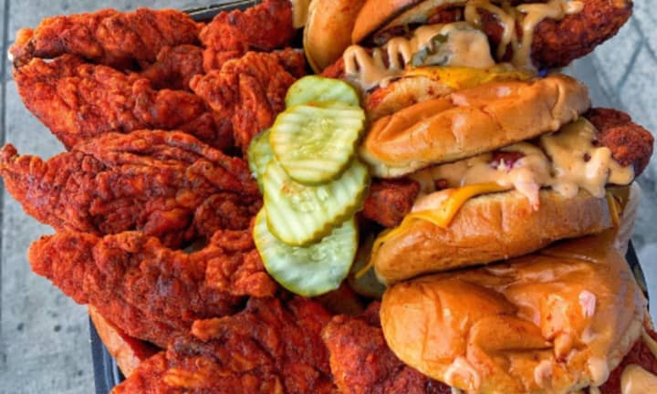 An sample of Dave&#x27;s Hot Chicken&#x27;s sliders and tenders plate