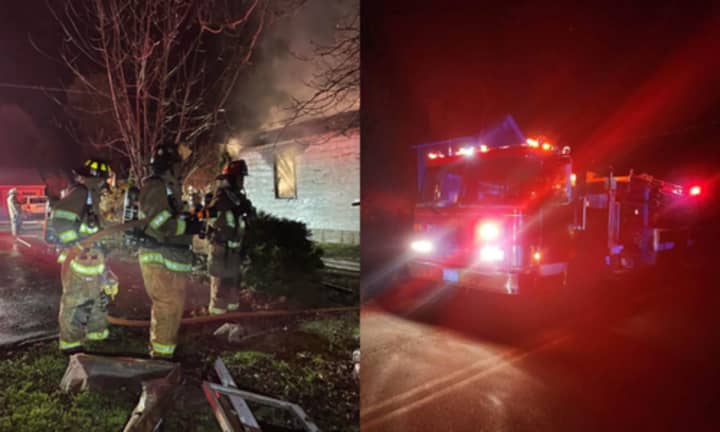 Firefighters with the Warwick Fire Department responding to a fatal 2-alarm fire in Northfield Sunday night, Nov. 13