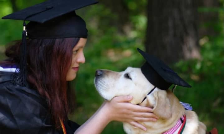 Isabella Scott (left) and her service dog O&#x27;Hara (right) on their graduation day