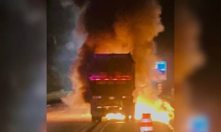Flames erupt from a garbage truck on I-495 in Hopkinton