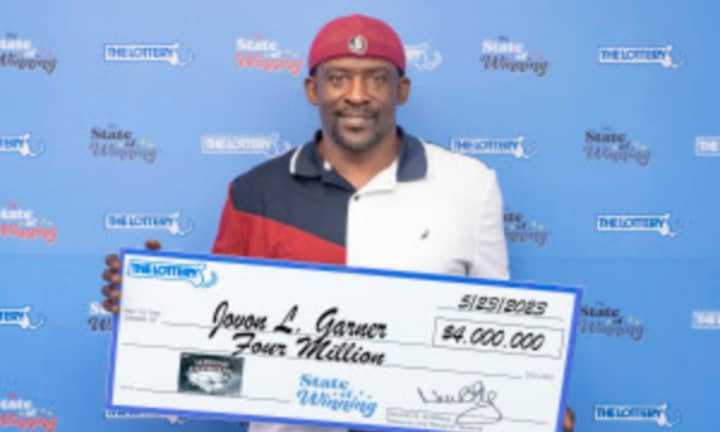 Jovon Garner holds his $4 million prize
