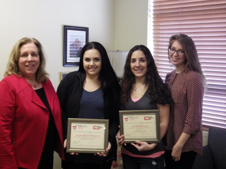 Katherine Quinn, (left) and Marisa Giuliano (right), of Support Connection, present certificates of appreciation to Kristi Tumminia (second from), owner of Spotlight Studios of Dance &amp; Performing Arts and Alexis Menendez
