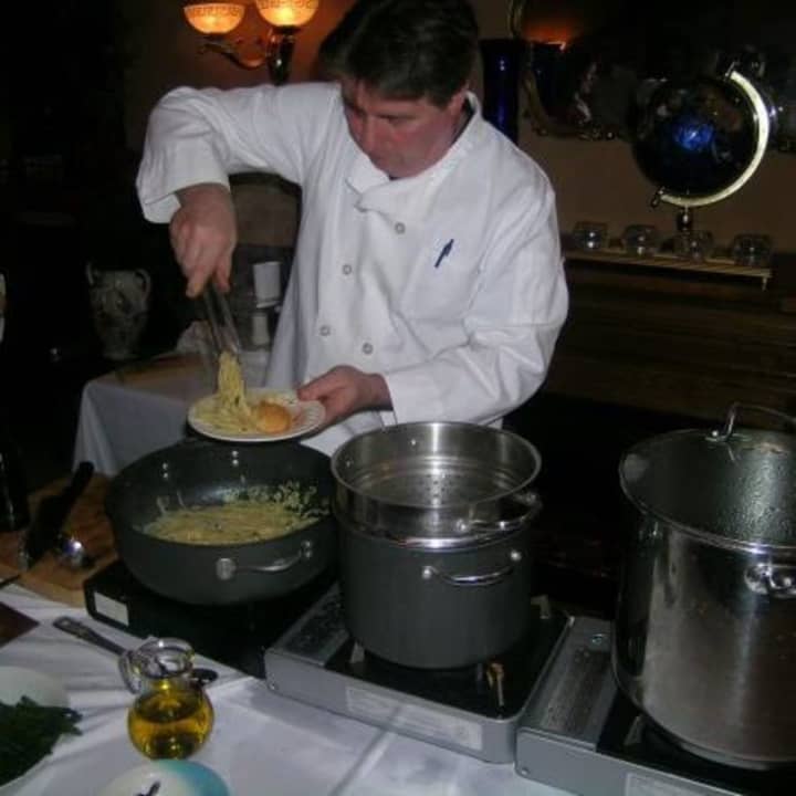 John Carollo, Del&#x27;Arte&#x27;s owner and chef, whips up a dish tableside at the Orangeburg restaurant.