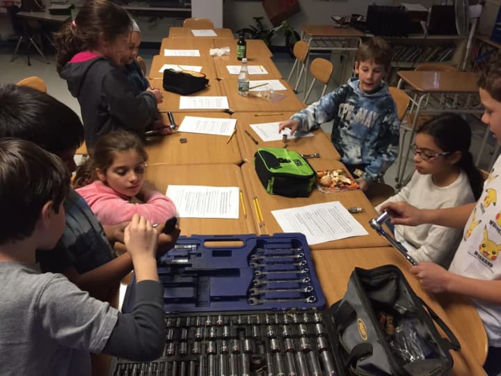 Do-It-Yourself inventors disassembled and reassembled a bicycle at F. E. Bellows Elementary School.