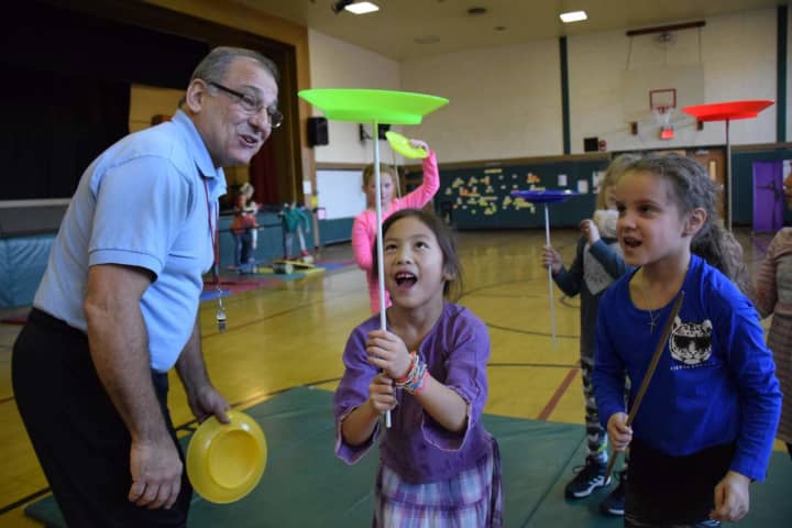 Dows Lane Elementary School second-graders learned plate spinning during a visit by the Amazing Grace Circus.