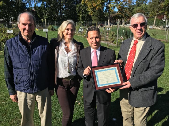 Norwalk Land Trust officials, left to right, Seeley Hubbard, past president; Vickie Bennett, board member, and John Moeling, president, present Senate Majority Leader Bob Duff, center, with a citation for service at Fodor Farm in Norwalk.