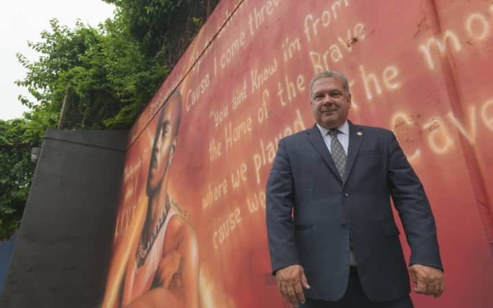 Yonkers Mayor Mike Spano in front of the new DMX mural at the Calcagno Houses behind 55 School St.