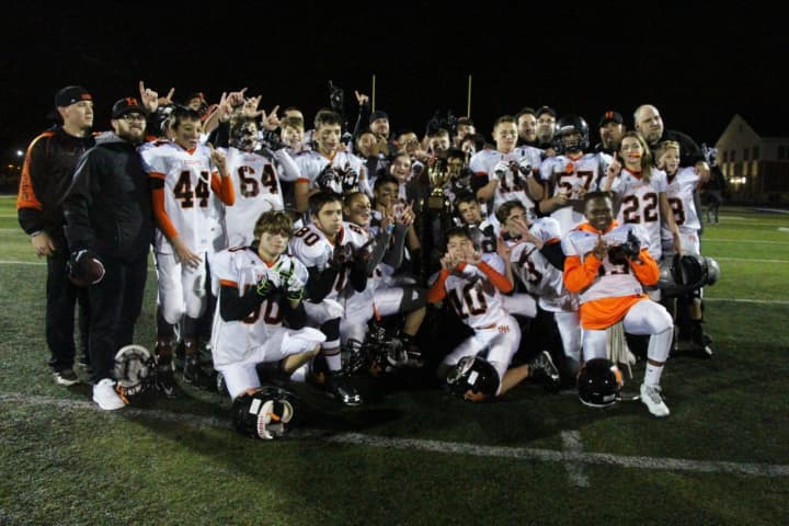 Hasbrouck Heights Senior Aviators pose with the championship trophy after their win against Carlstadt-East Rutherford in the 2016 MFL Super Bowl.