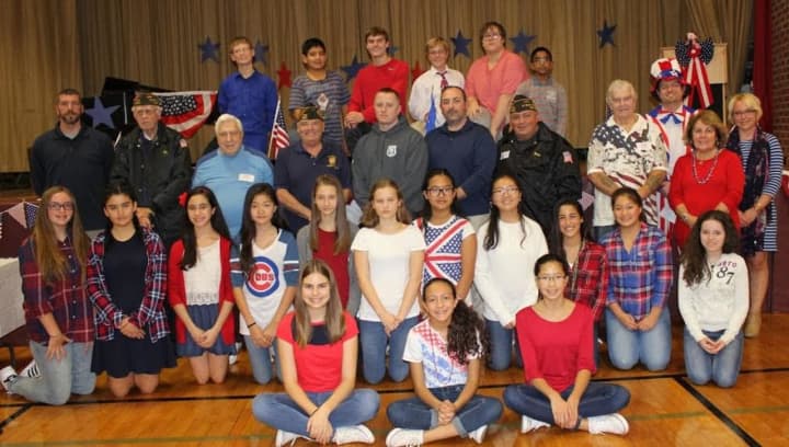 Students from Alfred S. Faust Honors English class and members of the East Rutherford VFW after the Veterans Day program.