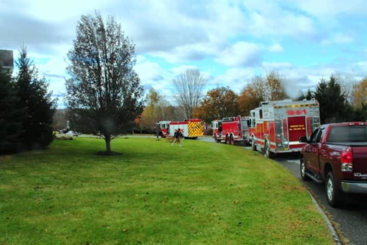 Mahopac Falls fire trucks line Emily Lane during a house fire Sunday.