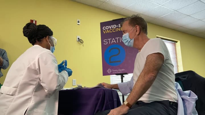 Connecticut Gov. Ned Lamont receiving his first dose of the COVID-19 vaccine.