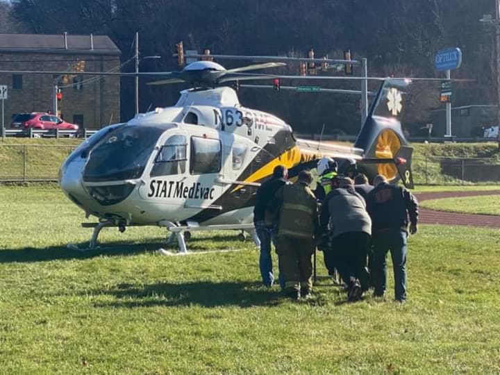 The worker being rushed to the STAT MedEvac helicopter.