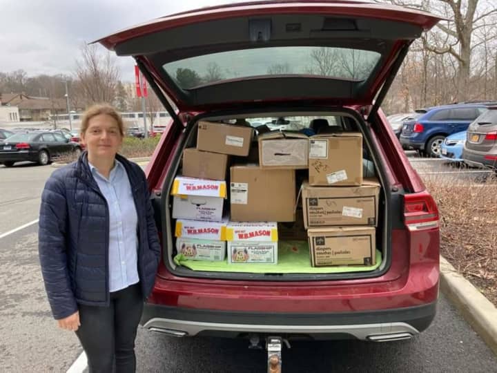 “My SUV fits a lot of stuff. Often I can’t see my child behind the boxes,” said Ulyana Bolgachenko, pictured here. “But she’s used to it now.”