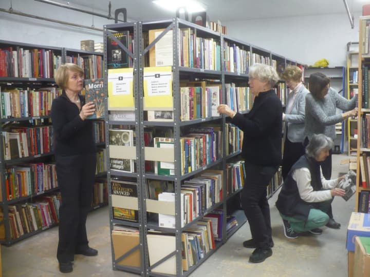 Members of the Friends of the Englewood Library sort and shelve books for their huge book sale April 29, 30, and May 1.
