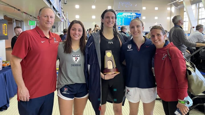Penn Swimming Coaches with Catherine Buroker (left), Lia Thomas (center) Anna Kalandadze (right) after the competition